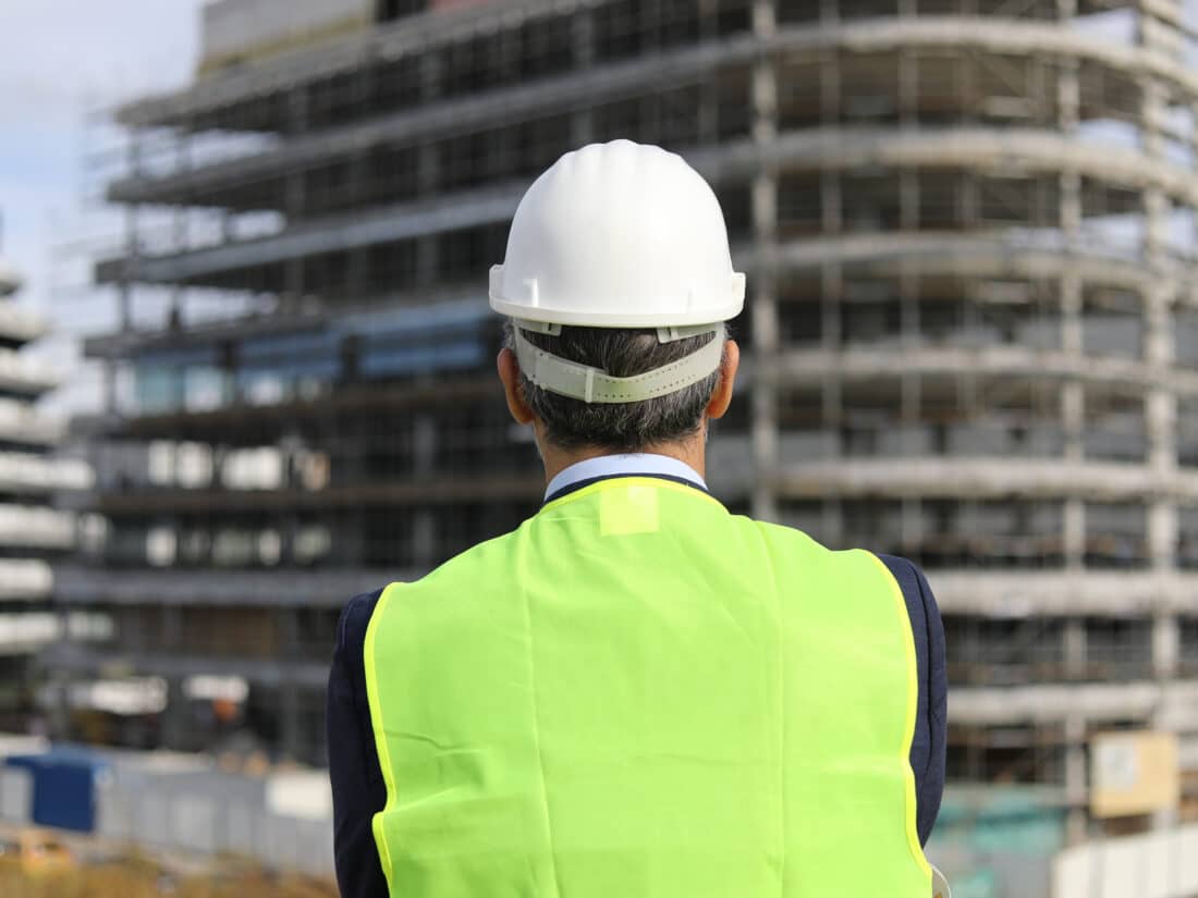 Back,View,Of,The,Engineer,In,Worker,Helmet