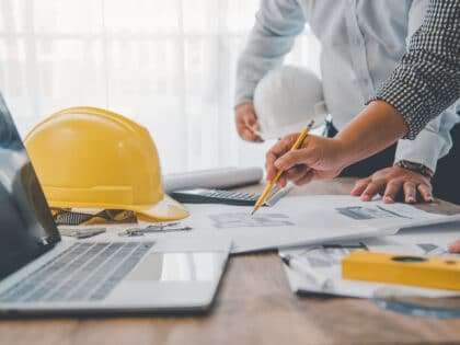 Engineer,Working,In,Office,With,Blueprints,,Inspection,In,Workplace,For